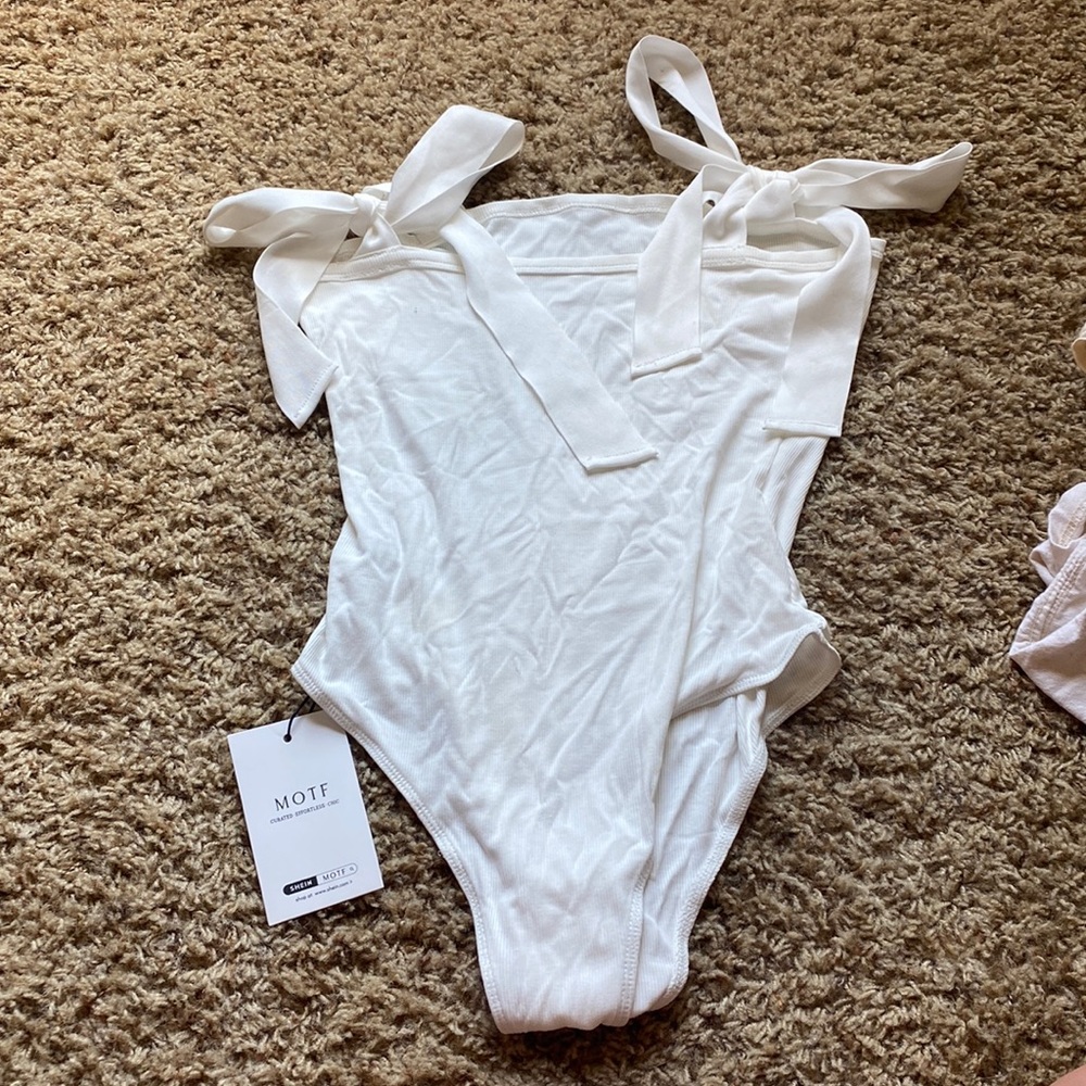 White bodysuit with bows